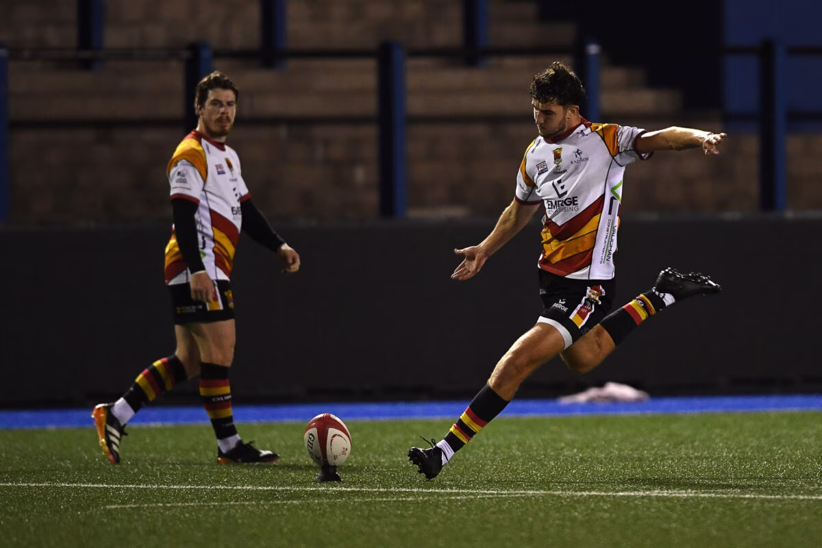Elis Price of Carmarthen Quins kicks the match-winner against Cardiff