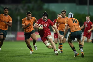 Evan Minto looks for a gap against Australia