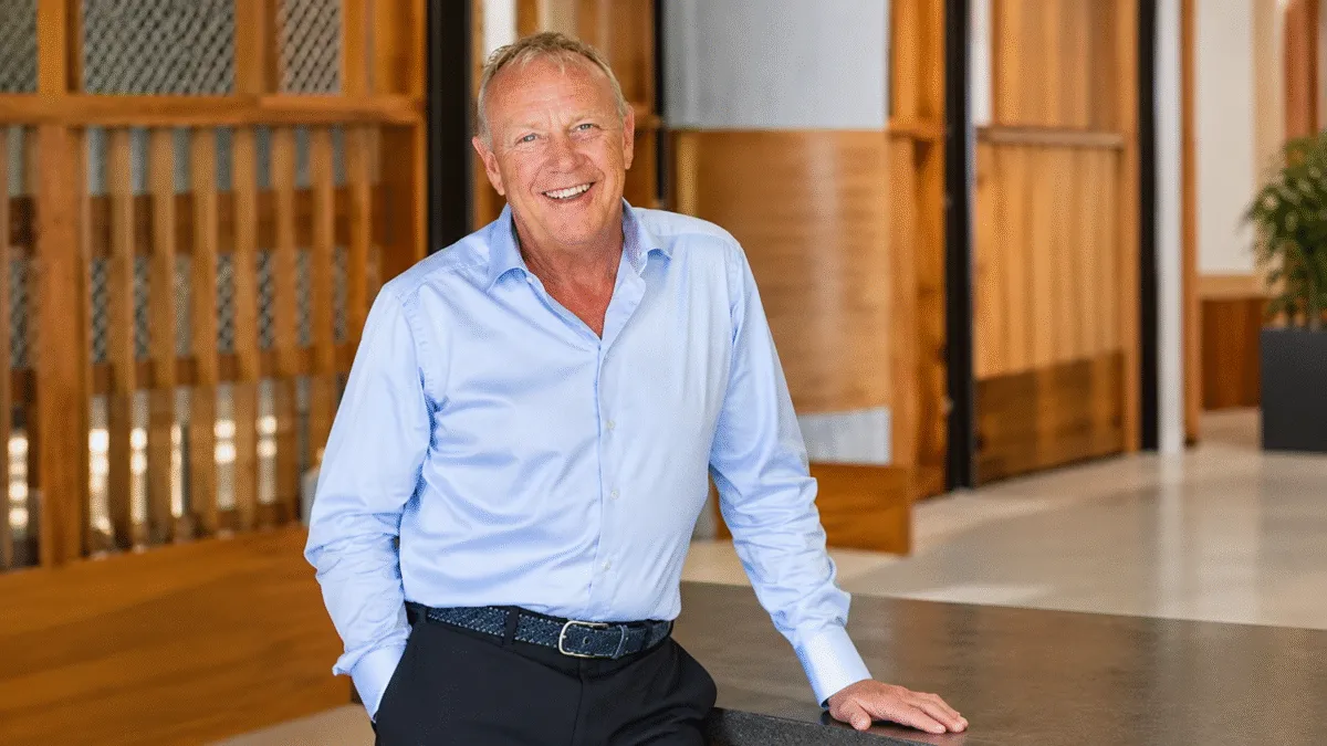 Warm Office Portrait with Smiling Senior Man Lyndon Faulkner